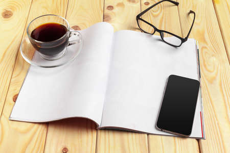 Mock-up magazine or catalog on a wooden table.の写真素材