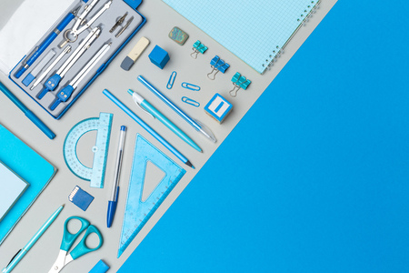 school supplies at colorful paper backgroundの写真素材