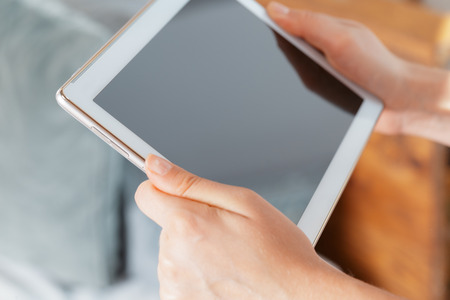woman holding digital tablet, closeupの写真素材