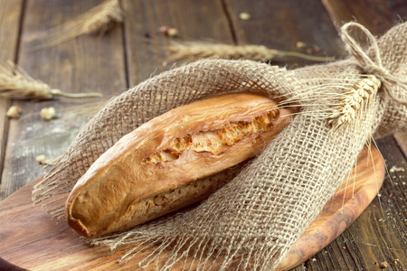 baked bread on wooden table backgroundの写真素材
