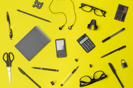 school supplies at colorful paper backgroundの写真素材