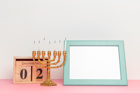 Bronze Hanukkah menorah with burning candlesの写真素材