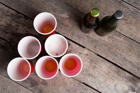 Game Beer Pong on wooden tableの写真素材