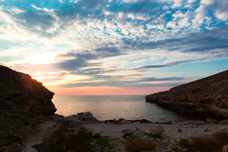 Brilliant vacation destination beach sunrise and sea cliffs backgroundの写真素材
