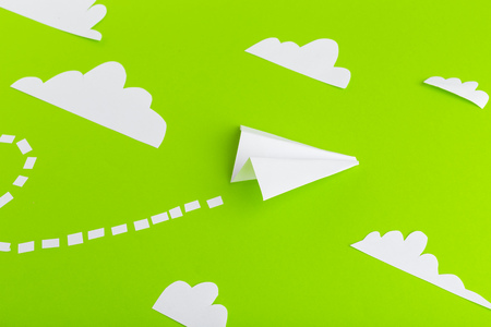 Paper airplanes  connected with dotted lines on green background. Business conceptの写真素材