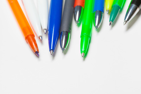 different colors pens isolated on the white backgroundの写真素材