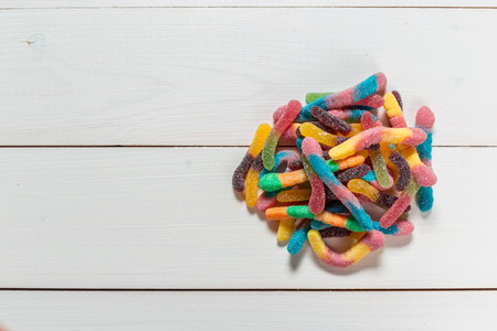 Colorful candies on wooden backgroundの写真素材