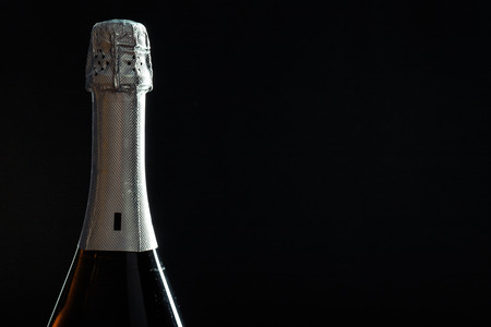 Bottle of champagne on black background.の写真素材
