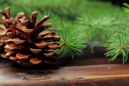 Christmas composition with fir tree branches on wooden background.の写真素材