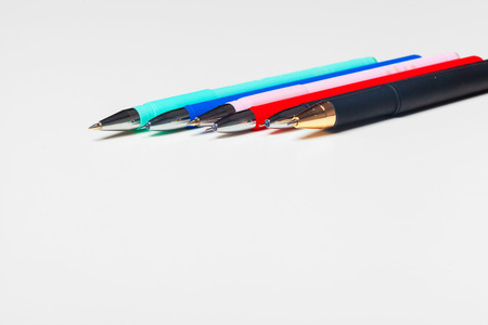 different colors pens isolated on the white backgroundの写真素材