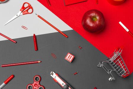 school supplies at colorful paper backgroundの写真素材