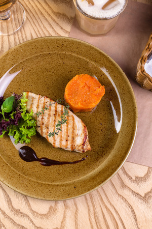 Grilled chicken fillet on plateの写真素材