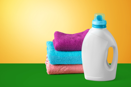 housekeeping set with towels and plastic bottlesの写真素材