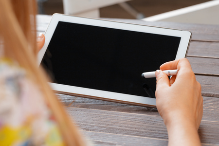 woman holding digital tablet, closeupの写真素材