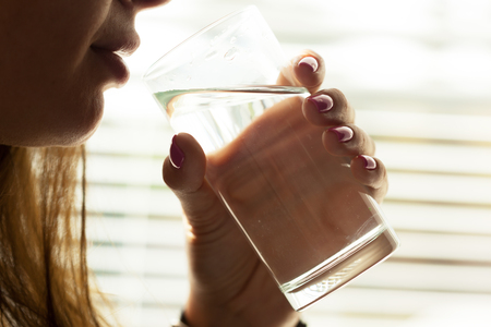Young woman drinking water