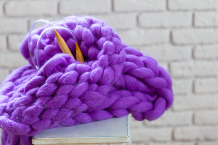 Incomplete knitting project with wooden needles