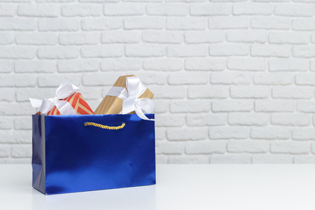 Gift box in paper shopping bagの写真素材