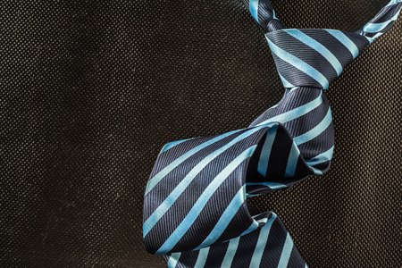 tie on dark backgroundの写真素材