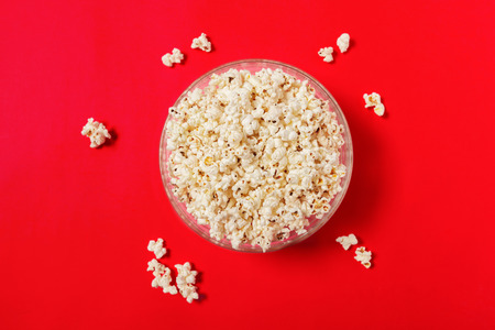 popcorn on color background