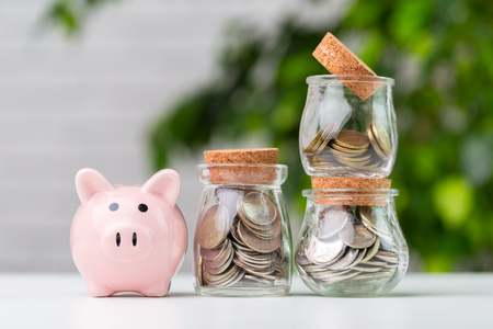 piggy bank with coin on the table