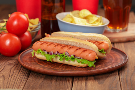 Hot dogs on wooden backgroundの写真素材