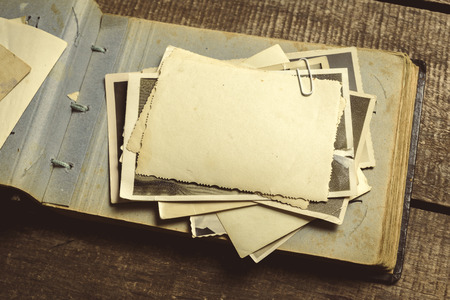 old photos on the wooden tableの写真素材