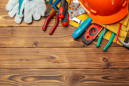 Assorted work tools on wooden table