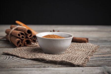 Cinnamon sticks on wooden background. creative photo