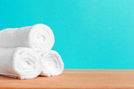 Clean soft towels on color background. creative photo.の写真素材