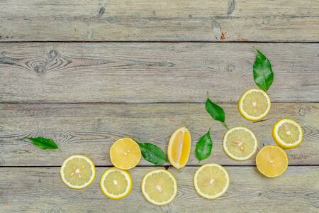 fresh lemons on wooden table.の写真素材