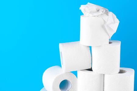 Toilet paper. Close up shot on blue background. creative photo.