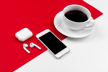 Mock up with copy space with smartphone on bright red backgroundの写真素材