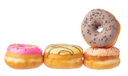 Delicious colorful donuts isolated on white background. Creative photo.の写真素材