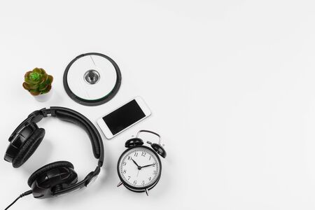 Headphones and alarm clock isolated on white background. Top viewの写真素材