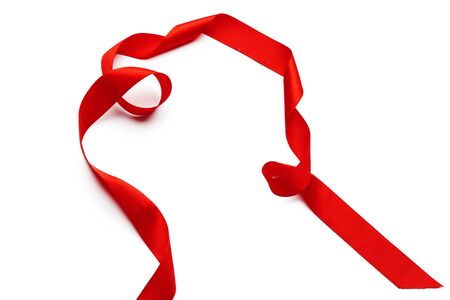 Red ribbon isolated on white. creative photo.の写真素材