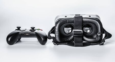 Virtual Reality glasses and game pad Isolated on white background.の写真素材