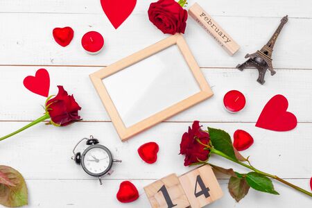 Creative Valentine Day romantic composition flat lay top view love holiday celebration red heart calendar date white wooden backgroundの写真素材