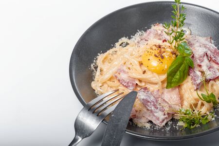 Delicious spaghetti pasta cook with crispy bacon serve. creative photo.の写真素材