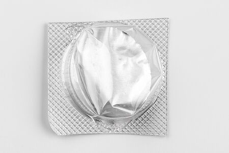 Silver blister packs pills isolated on white. creative photo.