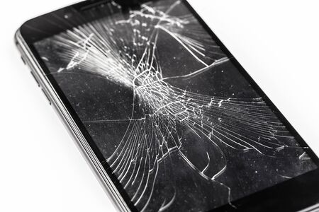 Mobile phone with broken screenの写真素材