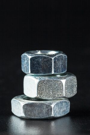 Bolts on black background. creative photo.の写真素材