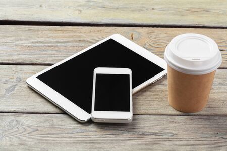digital tablet and smartphone on the tableの写真素材