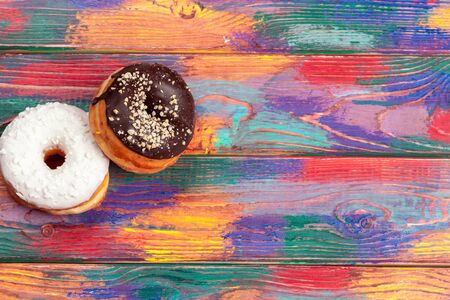 Colorful donuts assortment background top view close upの写真素材