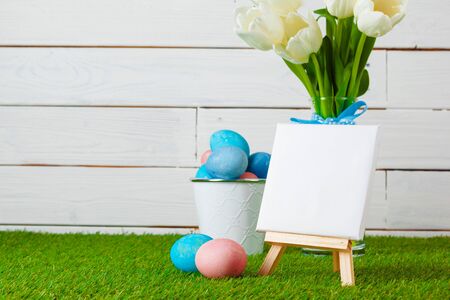 Easter Eggs with flower on Green Grass. creative photo.の写真素材