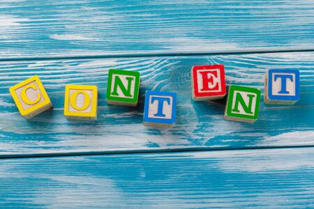 Wooden toy Blocks with the text: content. creative photo.の写真素材