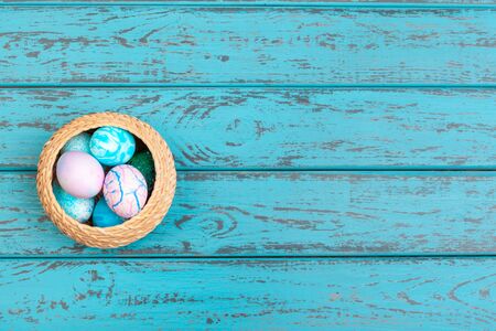 Colored easter eggs in a basket