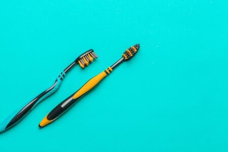 Toothbrushes on blue background. top view. creative photo.の写真素材