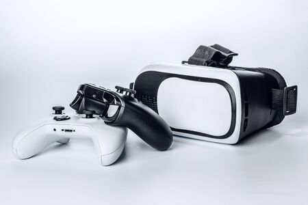 Virtual Reality glasses and game pad Isolated on white background.