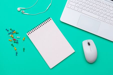 Office supplies and stationery on green background. creative photo.