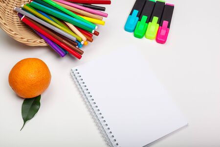 paper and colorful felt tip pens on the white tableの写真素材